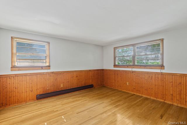 10 Brooker Drive Newburgh, NY 12550 - Photo 11 of 33 an empty room with wooden floor and windows