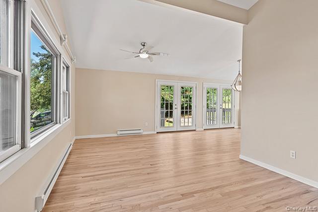 10 Brooker Drive Newburgh, NY 12550 - Photo 2 of 33 a view of an empty room with wooden floor and a window