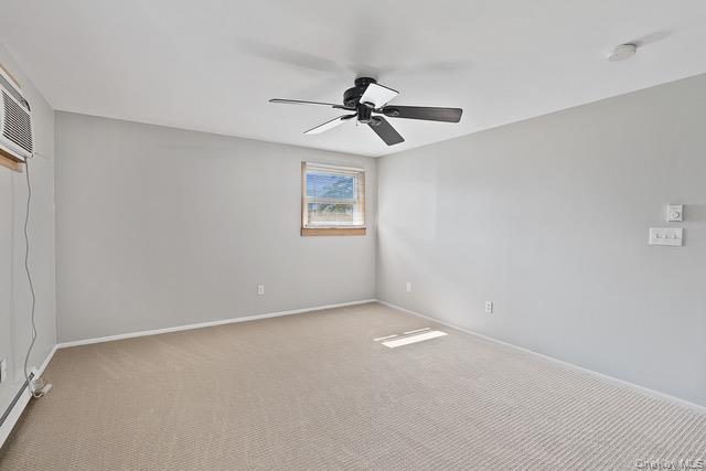 10 Brooker Drive Newburgh, NY 12550 - Photo 9 of 33 an empty room with windows and fan