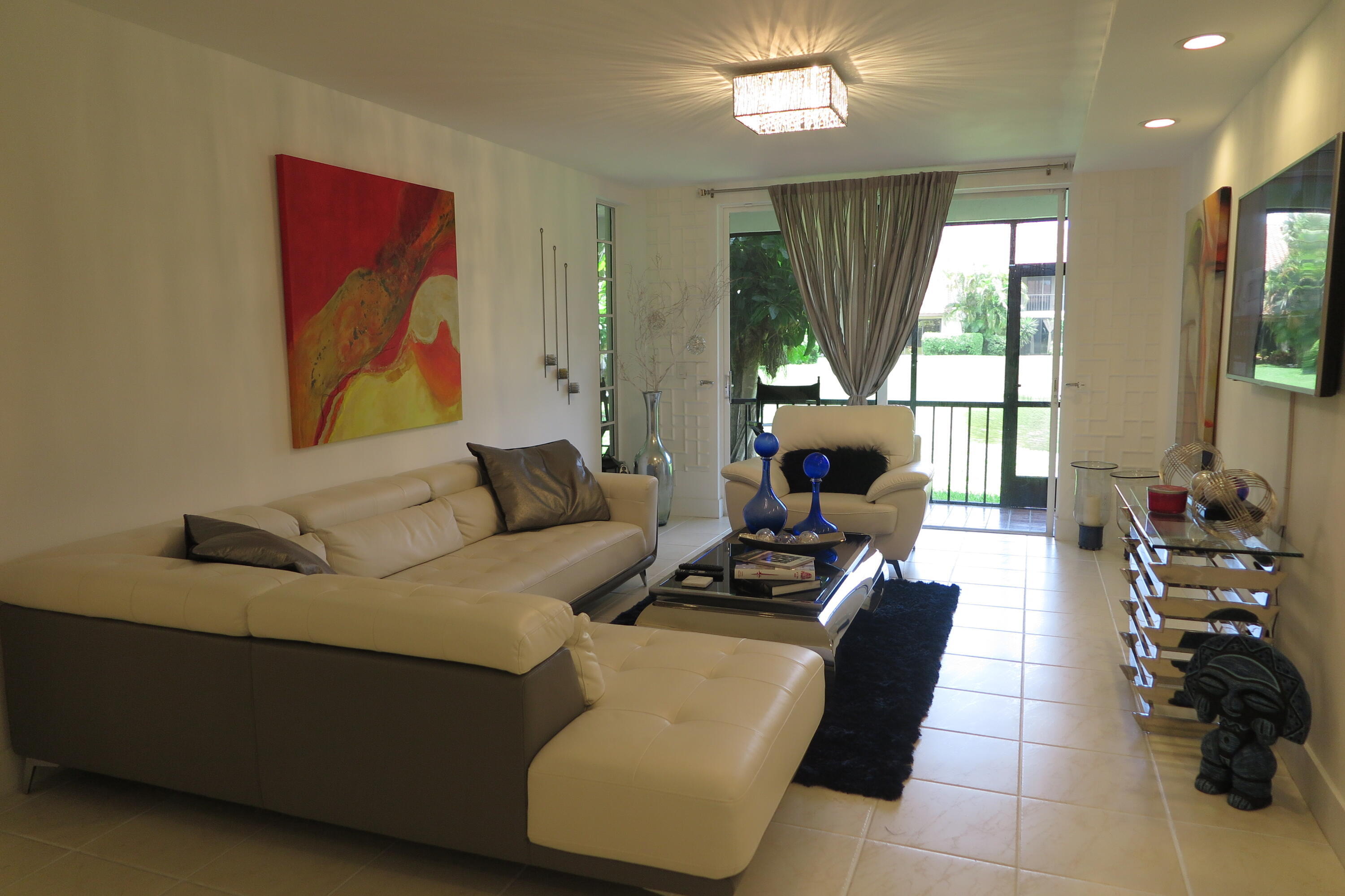 7875 La Mirada Drive Boca Raton, FL 33433 - Photo 7 of 31 a living room with furniture and a large window