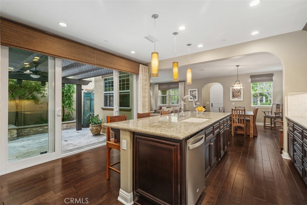 20 Old Mission Road Aliso Viejo, CA 92656 - Photo 11 of 35 a kitchen with a stove and a wooden floor