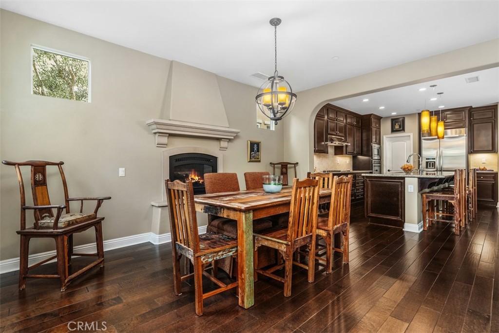 20 Old Mission Road Aliso Viejo, CA 92656 - Photo 7 of 35 a view of a dining room with furniture wooden floor and chandelier
