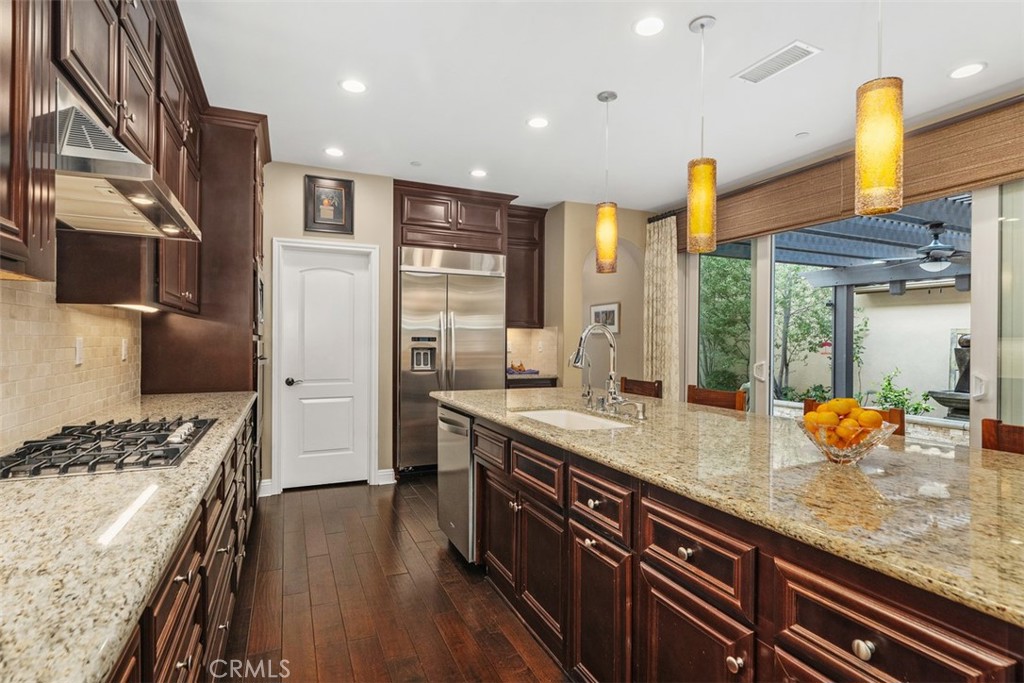 20 Old Mission Road Aliso Viejo, CA 92656 - Photo 9 of 35 a kitchen with stainless steel appliances a sink stove and refrigerator
