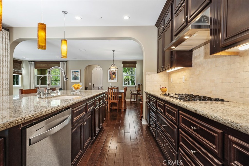 20 Old Mission Road Aliso Viejo, CA 92656 - Photo 10 of 35 a kitchen with stainless steel appliances granite countertop a stove and a sink