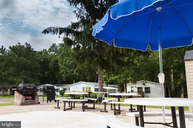 an outdoor space with furniture and umbrella