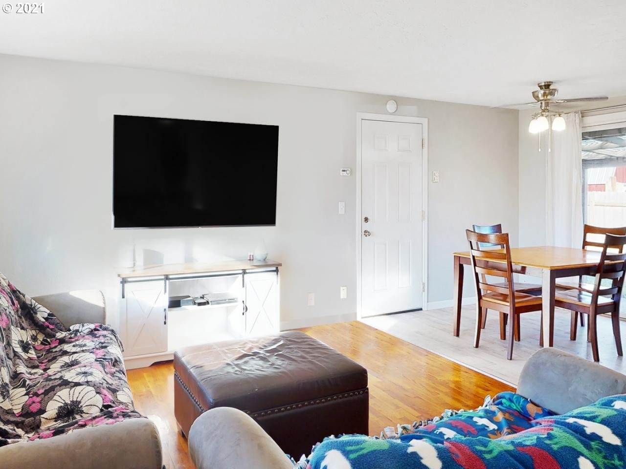 3440 C Street Springfield, OR 97478 - Photo 2 of 21 a living room with furniture and a flat screen tv