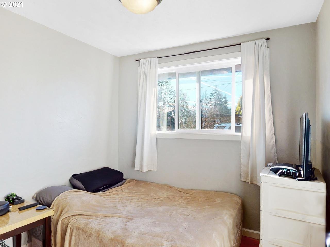 3440 C Street Springfield, OR 97478 - Photo 13 of 21 a bedroom with a bed and a window