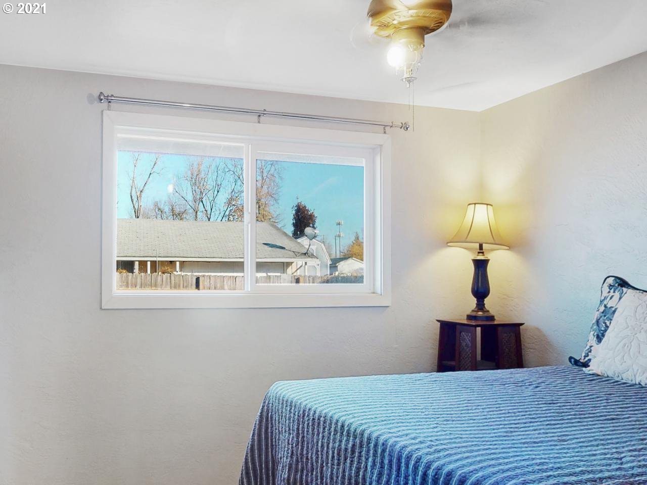 3440 C Street Springfield, OR 97478 - Photo 17 of 21 a bedroom with a bed and a painting on the wall