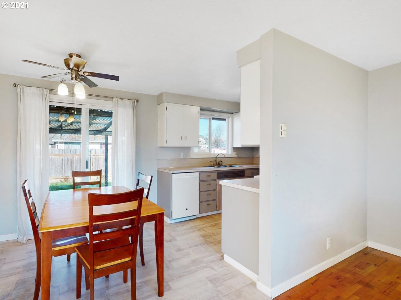 3440 C Street Springfield, OR 97478 - Photo 5 of 21 a dining room with kitchen island stainless steel appliances a table and chairs