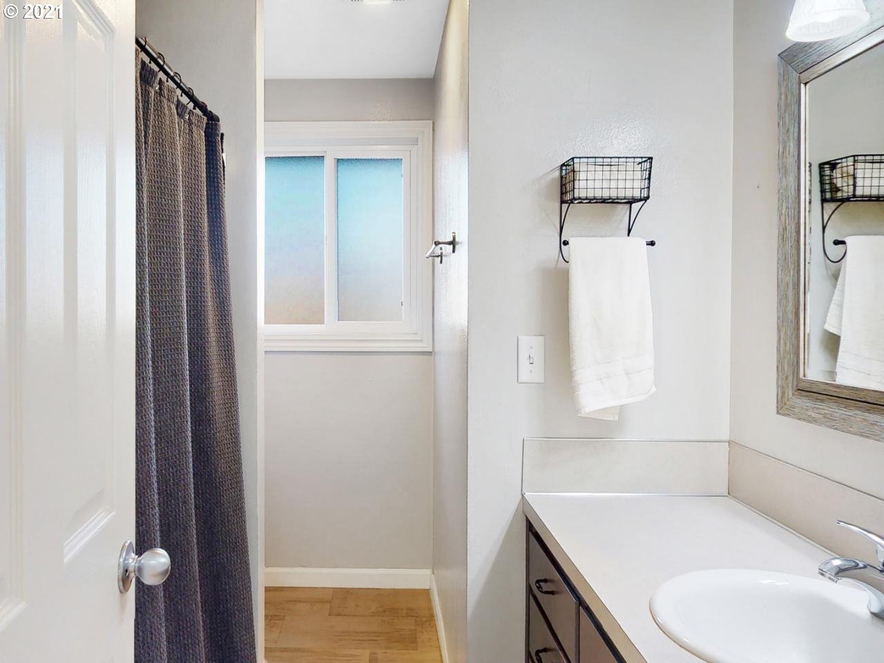 3440 C Street Springfield, OR 97478 - Photo 10 of 21 a bathroom with a sink toilet and shower