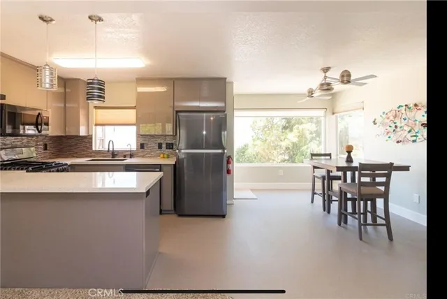 a view of an empty room and a window