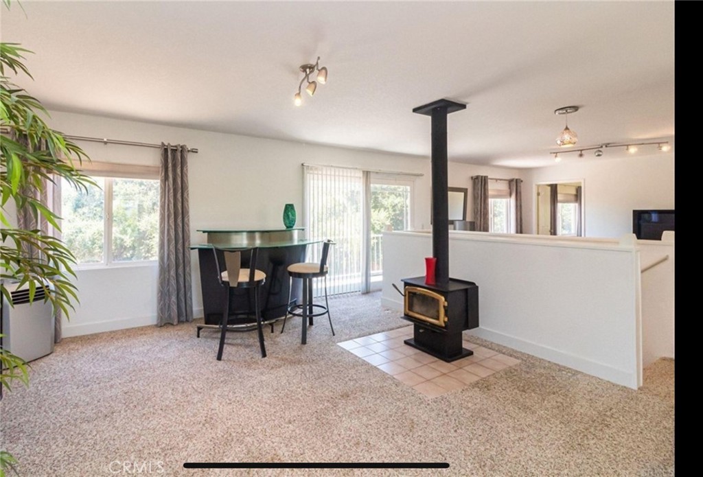 10210 Lilac Ridge Road Escondido, CA 92026 - Photo 20 of 26 a living room with furniture and a potted plant