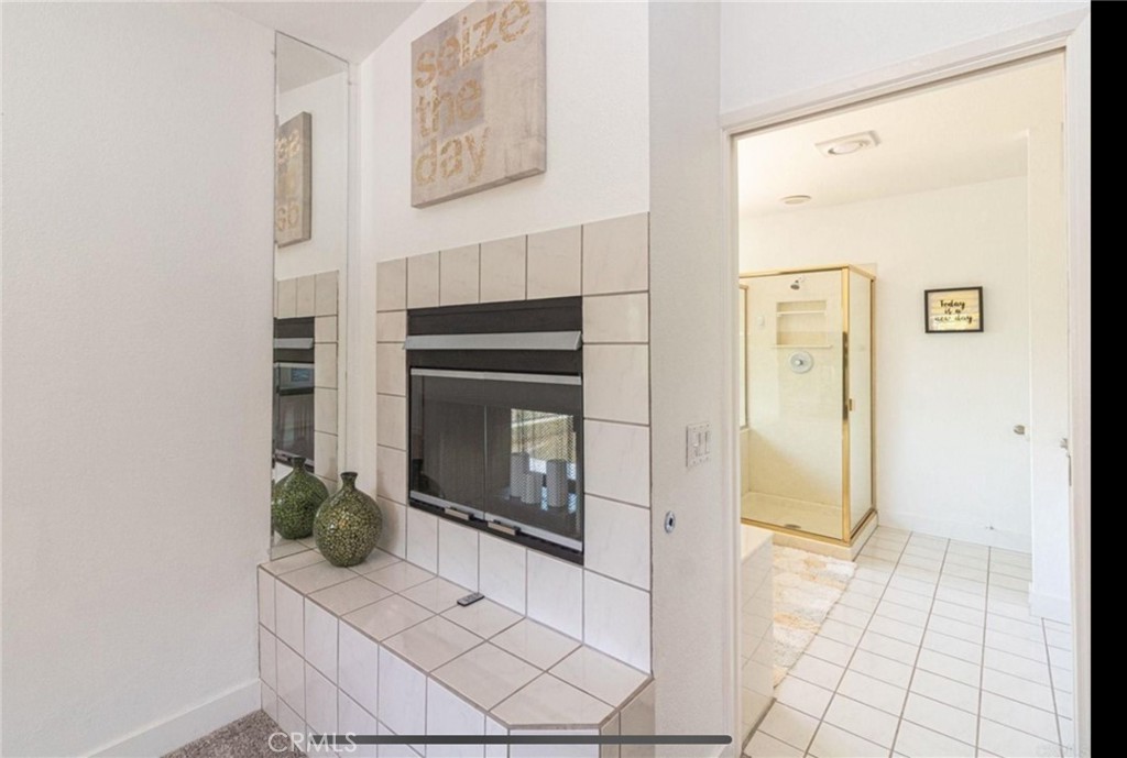 10210 Lilac Ridge Road Escondido, CA 92026 - Photo 23 of 26 a living room with a fireplace