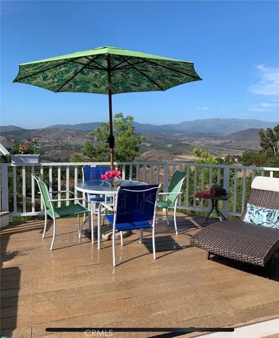 an outdoor space with furniture and umbrella
