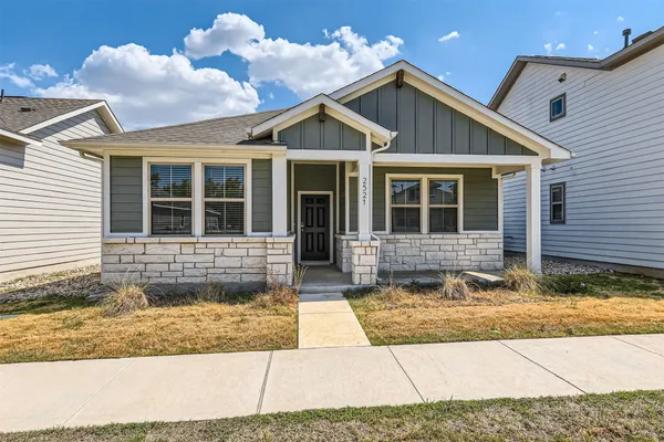 a view of house with yard
