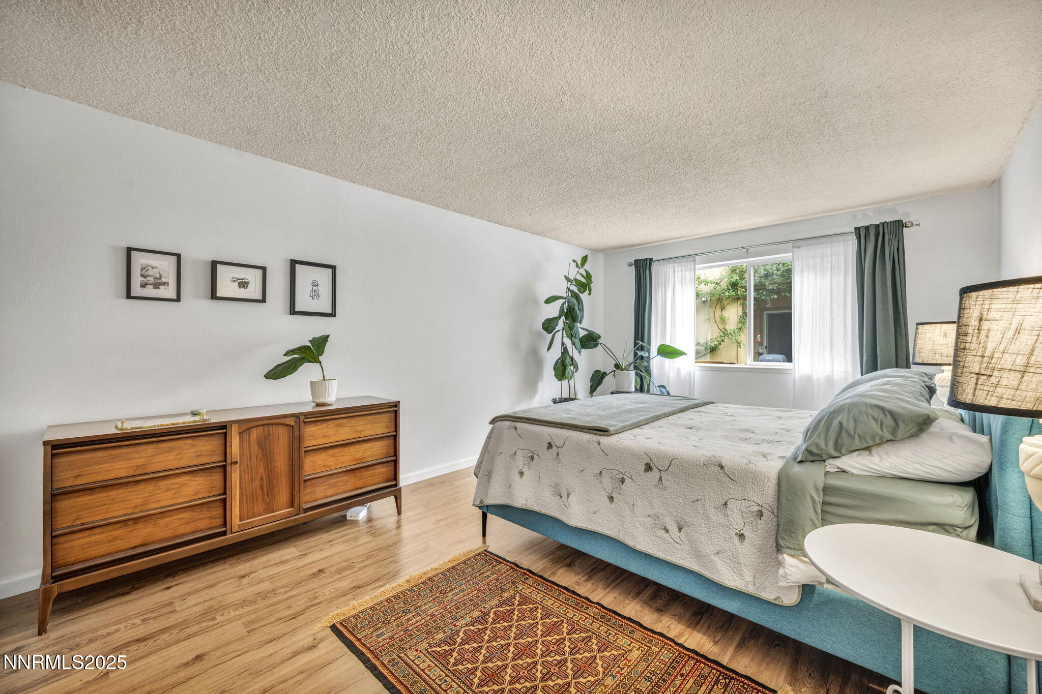 2300 Dickerson Road, Unit 25 Reno, NV 89503 - Photo 23 of 40 a spacious bedroom with a bed and window
