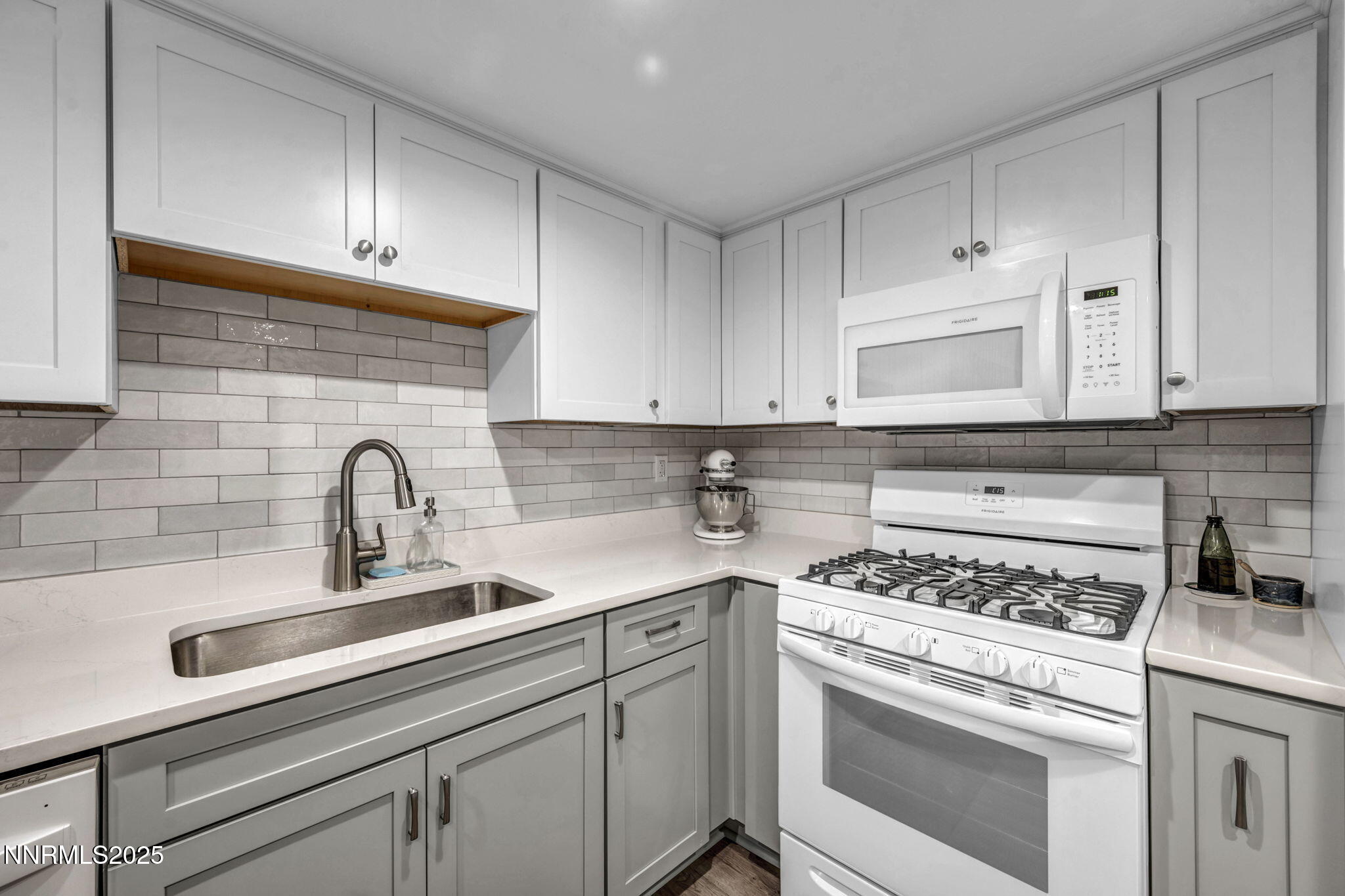 2300 Dickerson Road, Unit 25 Reno, NV 89503 - Photo 3 of 40 a kitchen with cabinets appliances a sink and a counter top