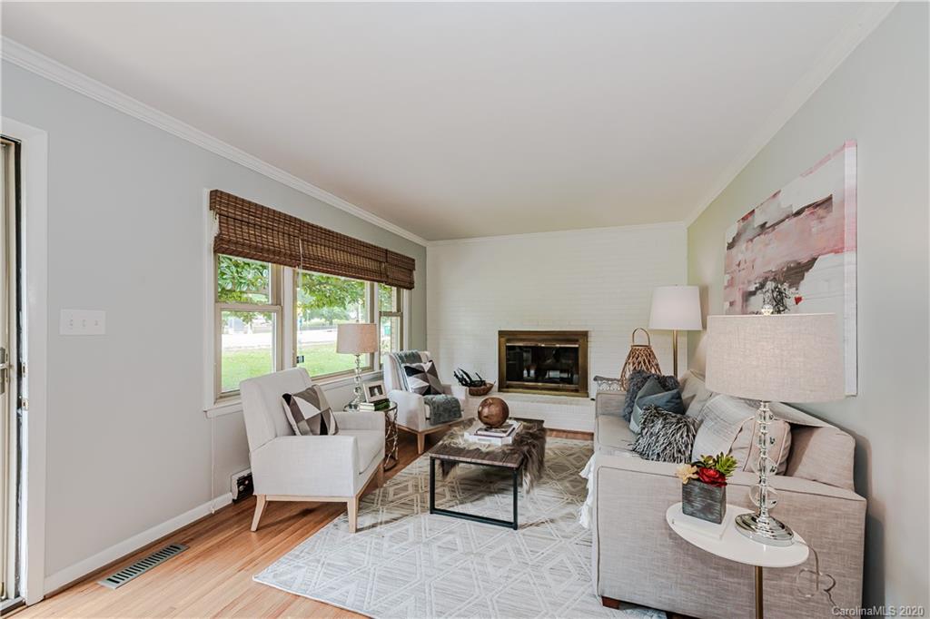 441 Scaleybark Road Charlotte, NC 28209 - Photo 2 of 24 a living room with furniture fireplace and a flat screen tv