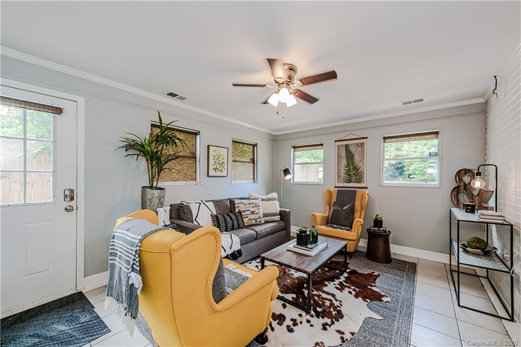 441 Scaleybark Road Charlotte, NC 28209 - Photo 12 of 24 a living room with furniture and a window