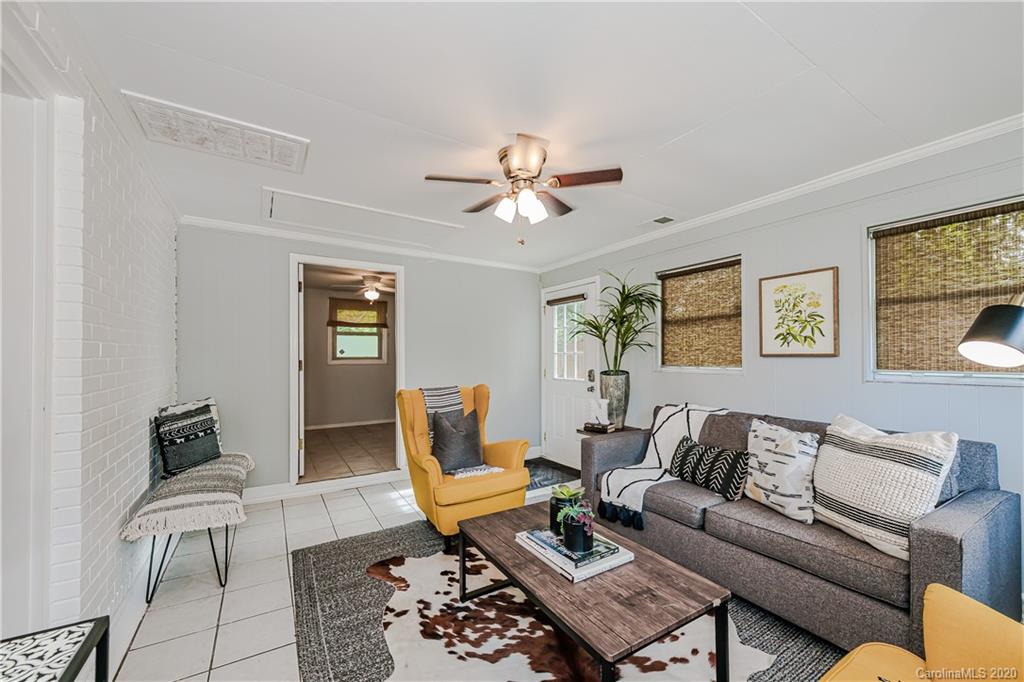 441 Scaleybark Road Charlotte, NC 28209 - Photo 14 of 24 a living room with furniture a rug and a window