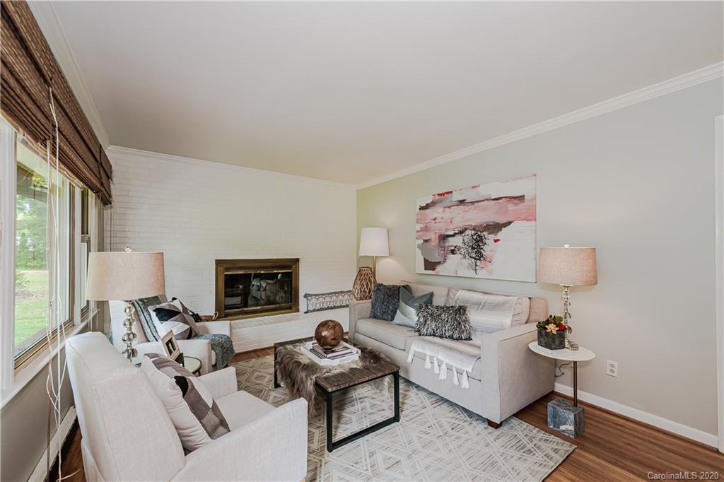 441 Scaleybark Road Charlotte, NC 28209 - Photo 3 of 24 a living room with furniture and a fireplace