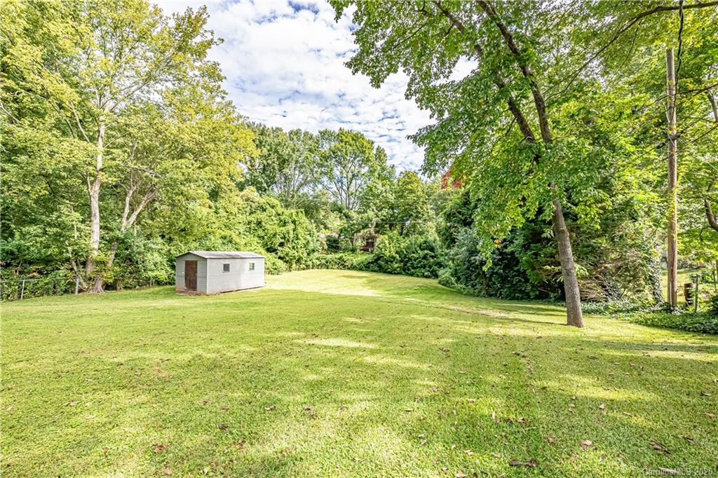 441 Scaleybark Road Charlotte, NC 28209 - Photo 21 of 24 a view of a trees with yard in front of the house