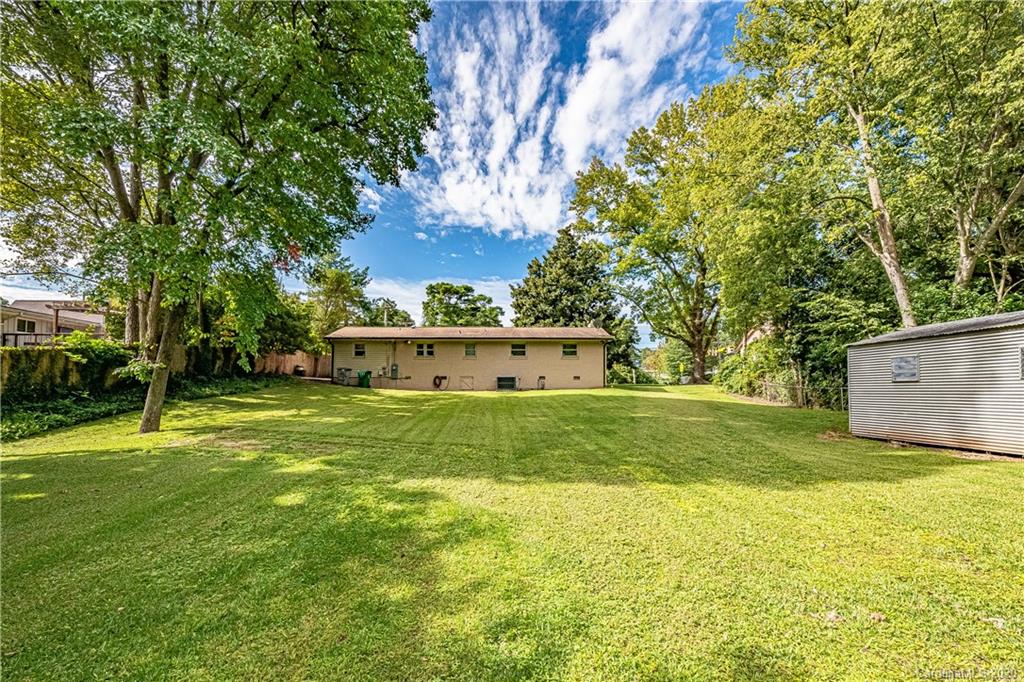 441 Scaleybark Road Charlotte, NC 28209 - Photo 22 of 24 a view of a house with a yard and sitting area