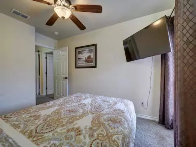 a bedroom with a bed and a dresser