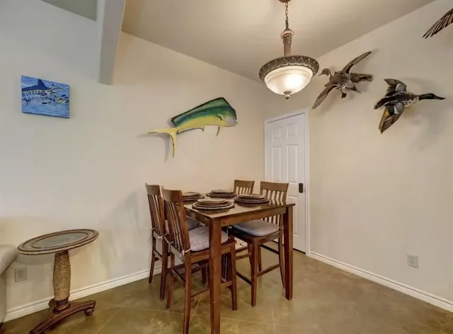a kitchen with stainless steel appliances a sink cabinets and wooden floor