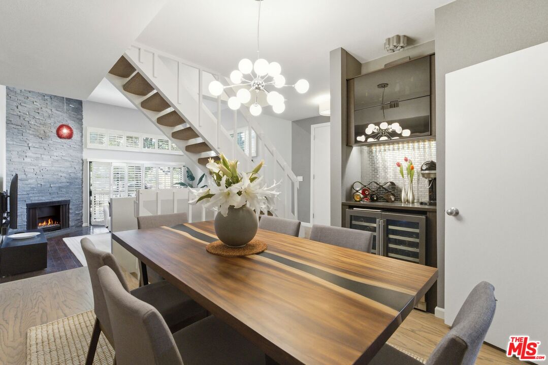 1013 16th Street, Unit 101 Santa Monica, CA 90403 - Photo 12 of 46 a dining room with furniture and chandelier
