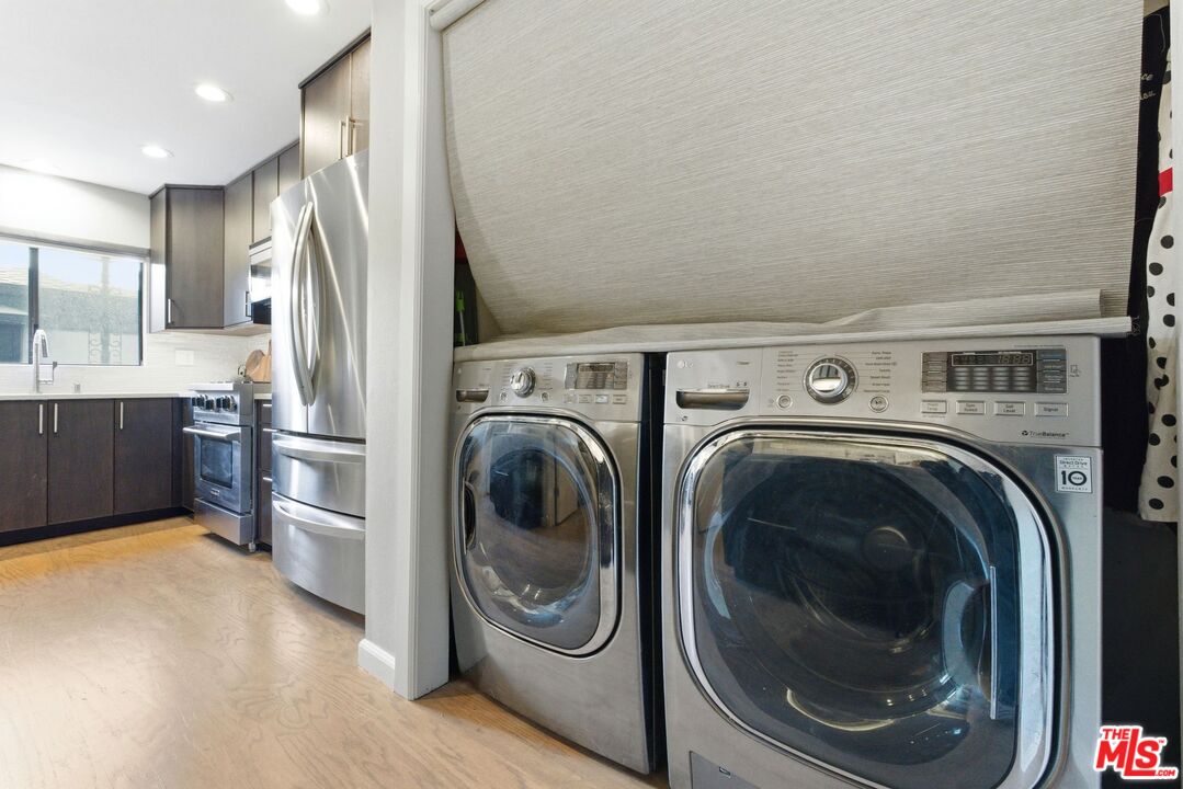 1013 16th Street, Unit 101 Santa Monica, CA 90403 - Photo 22 of 46 a view of a kitchen with washer and dryer