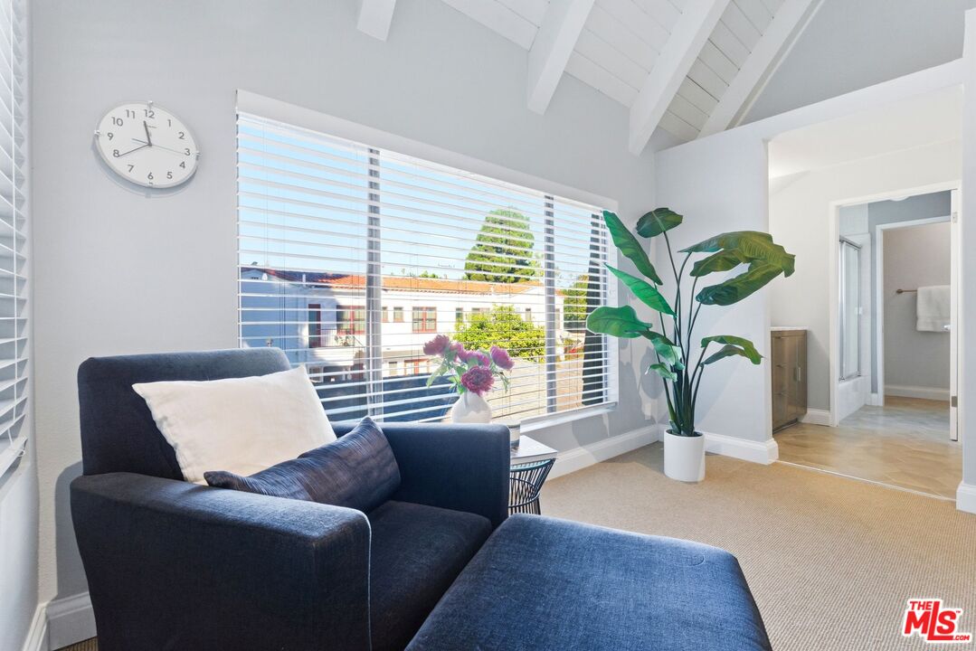 1013 16th Street, Unit 101 Santa Monica, CA 90403 - Photo 28 of 46 a living room with furniture and a large window