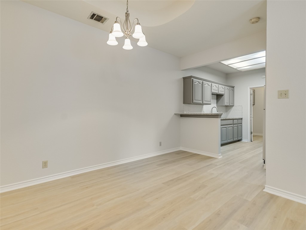 2601 Riddle Road, Unit A Austin, TX 78748 - Photo 4 of 10 an empty room with a kitchen and a sink