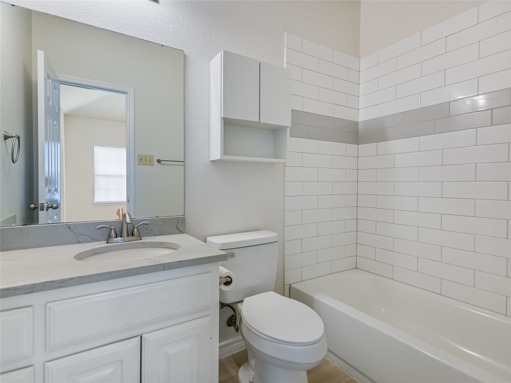 2601 Riddle Road, Unit A Austin, TX 78748 - Photo 9 of 10 a bathroom with a sink toilet and shower