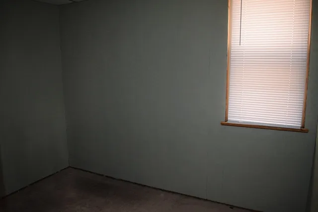 a view of empty room with windows