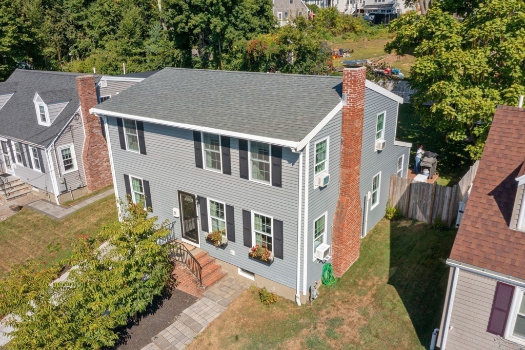 31 Broad Cove Road Hingham, MA 02043 - Photo 1 of 22 a aerial view of a house with a yard and potted plants
