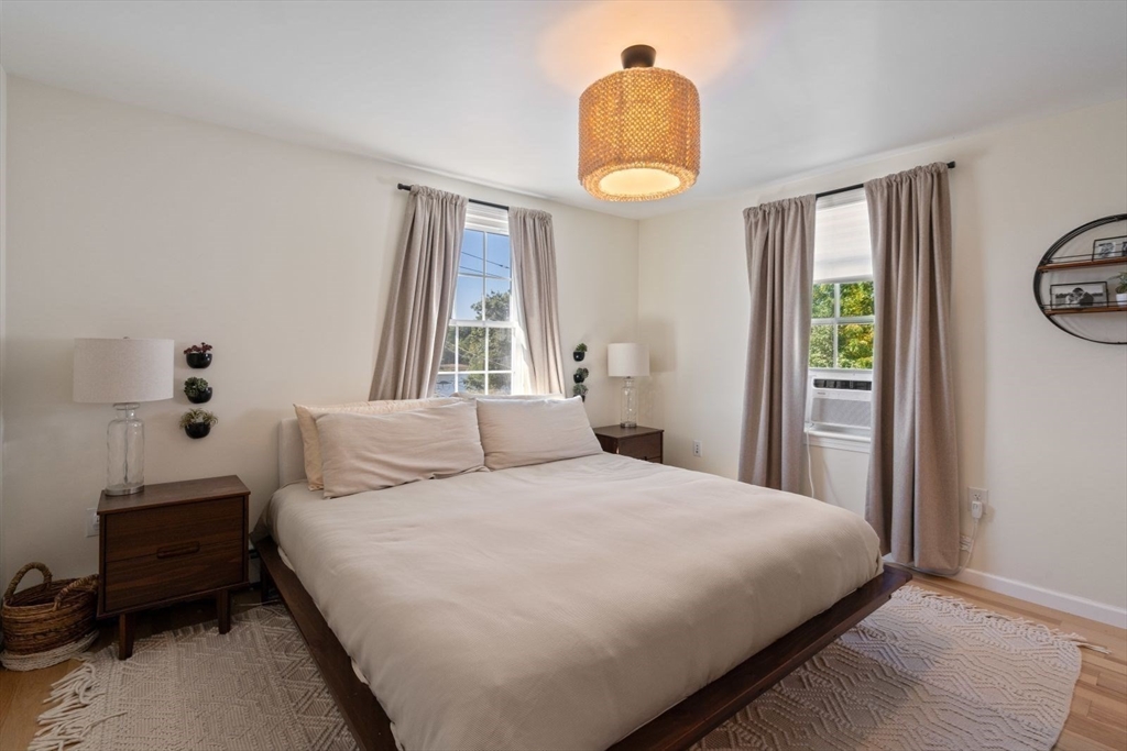 31 Broad Cove Road Hingham, MA 02043 - Photo 12 of 22 a bedroom with a bed and a window