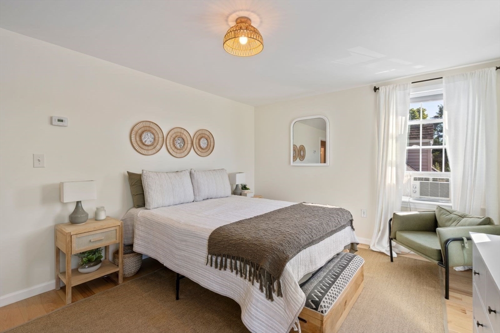 31 Broad Cove Road Hingham, MA 02043 - Photo 15 of 22 a bedroom with a bed and a window