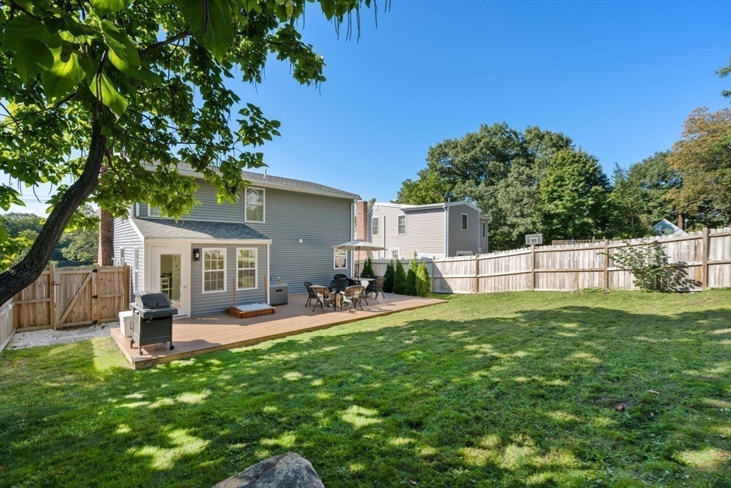 31 Broad Cove Road Hingham, MA 02043 - Photo 20 of 22 a house view with a sitting space and garden