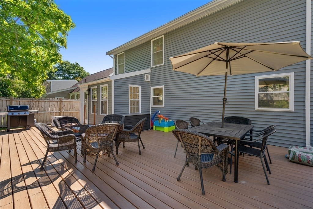31 Broad Cove Road Hingham, MA 02043 - Photo 22 of 22 a view of a dinning table and chairs in patio of the house