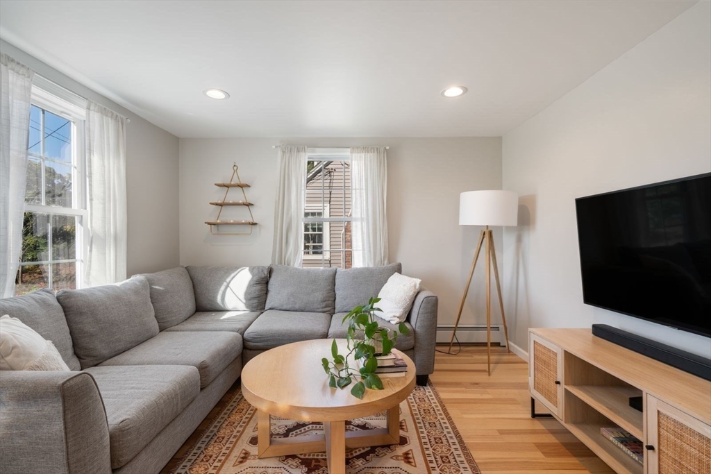 31 Broad Cove Road Hingham, MA 02043 - Photo 7 of 22 a living room with furniture and a flat screen tv