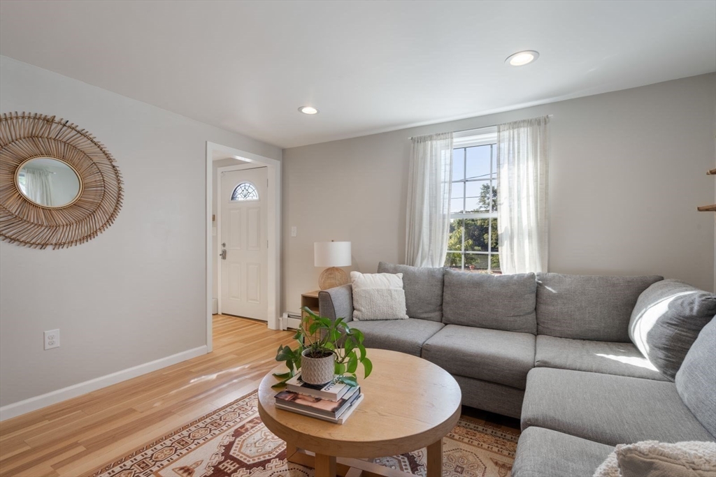 31 Broad Cove Road Hingham, MA 02043 - Photo 8 of 22 a living room with furniture and a window