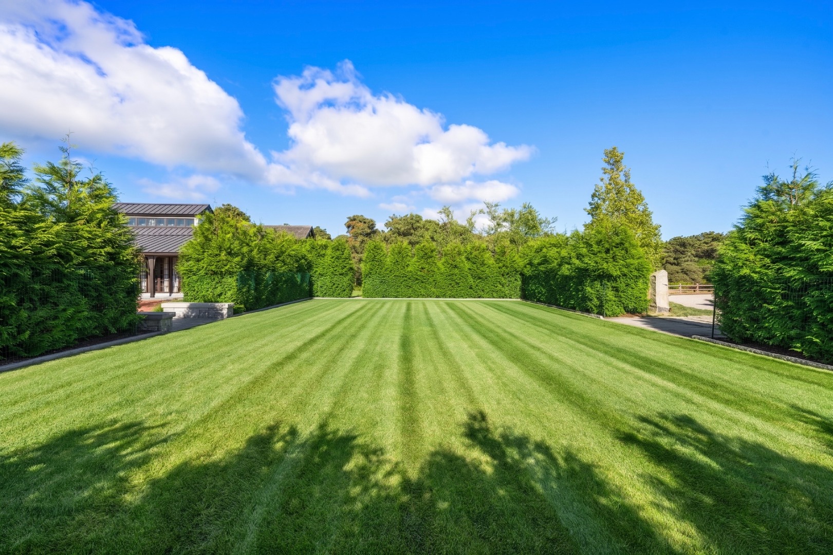 59 South Shore Road Nantucket, MA 02554 - Photo 22 of 54 a view of a big yard with potted plants and a yard