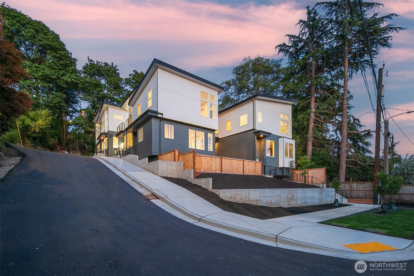 1802 28th Avenue South Seattle, WA 98144 - Photo 2 of 4 a front view of a house with a yard and garage