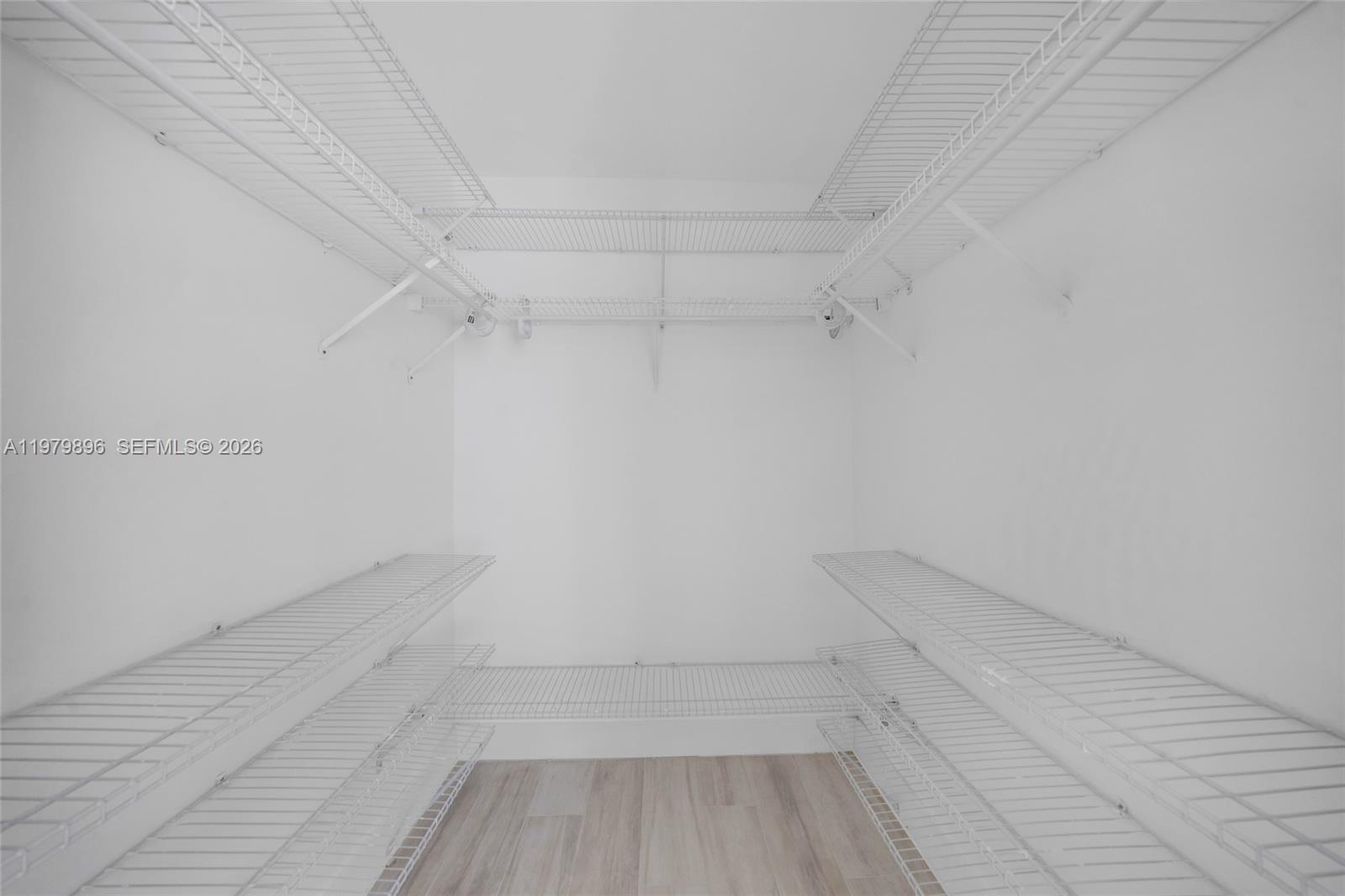 5760 Rock Island Road, Unit 321 Tamarac, FL 33319 - Photo 18 of 36 a view of a room with racks on the wall