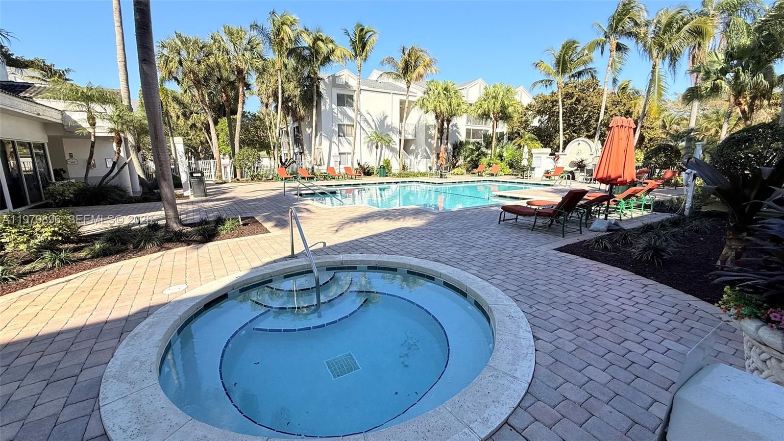5760 Rock Island Road, Unit 321 Tamarac, FL 33319 - Photo 28 of 36 a view of swimming pool with outdoor seating
