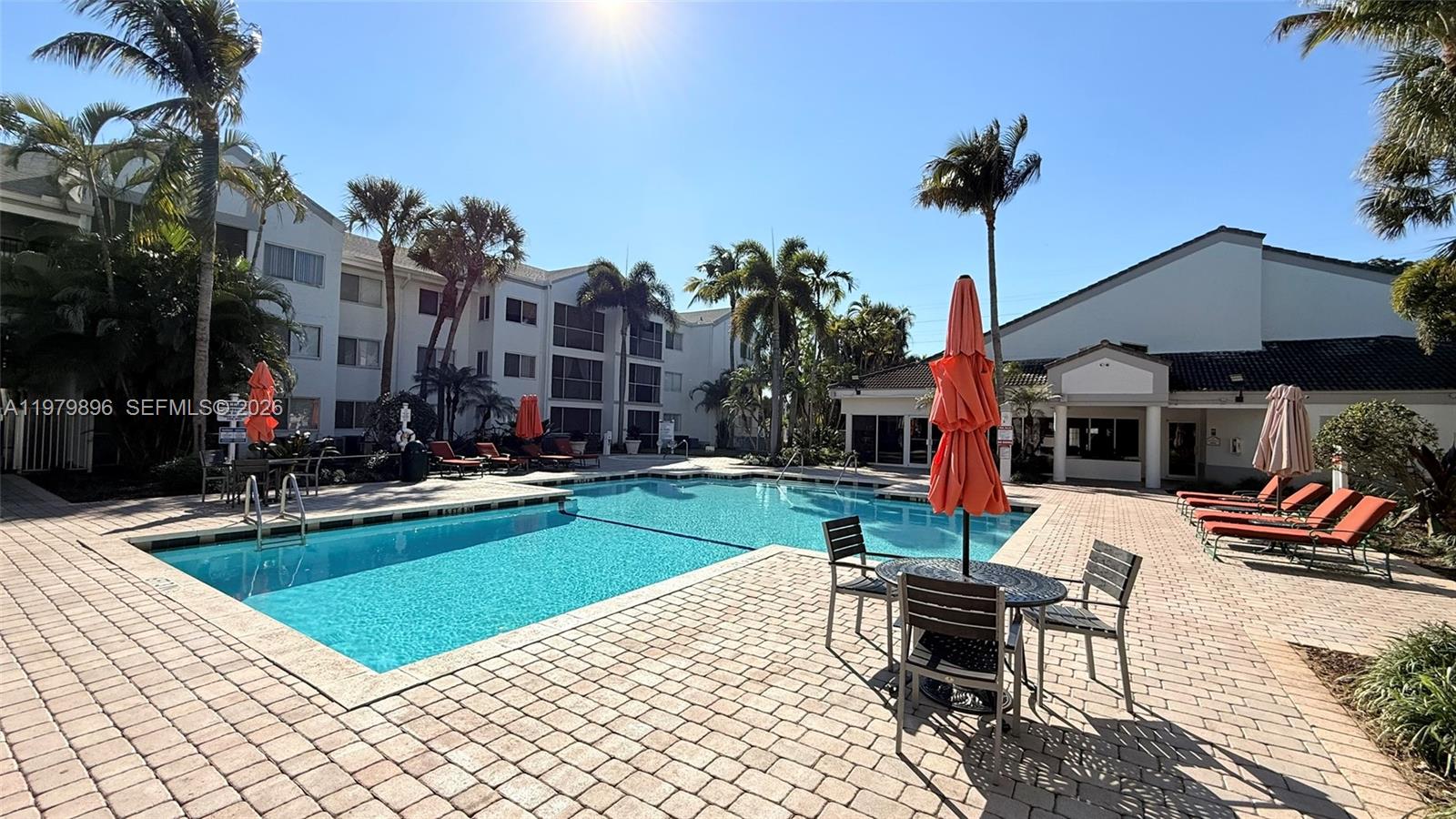 5760 Rock Island Road, Unit 321 Tamarac, FL 33319 - Photo 33 of 36 a view of outdoor kitchen with seating area