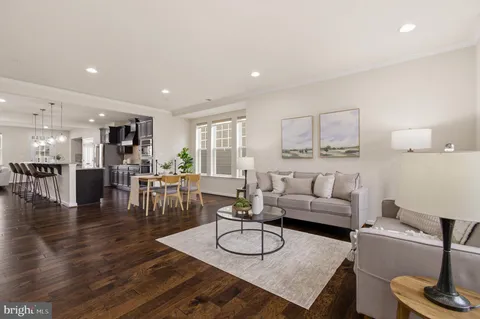 a kitchen with stainless steel appliances granite countertop a stove microwave and cabinets