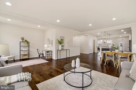 a kitchen with stainless steel appliances granite countertop a refrigerator a stove a sink and a refrigerator