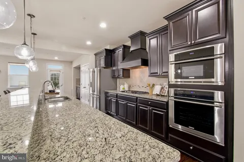 a kitchen with counter space cabinets and stainless steel appliances